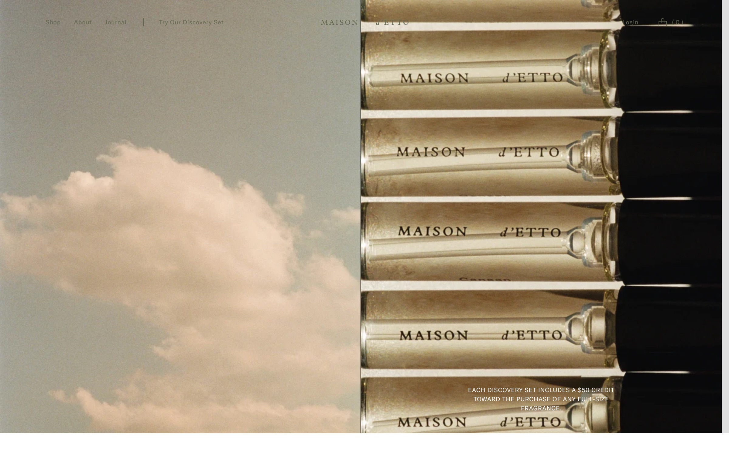 Old homepage: a photo of clouds beside a close-up of bottles, with faint navigation over the image